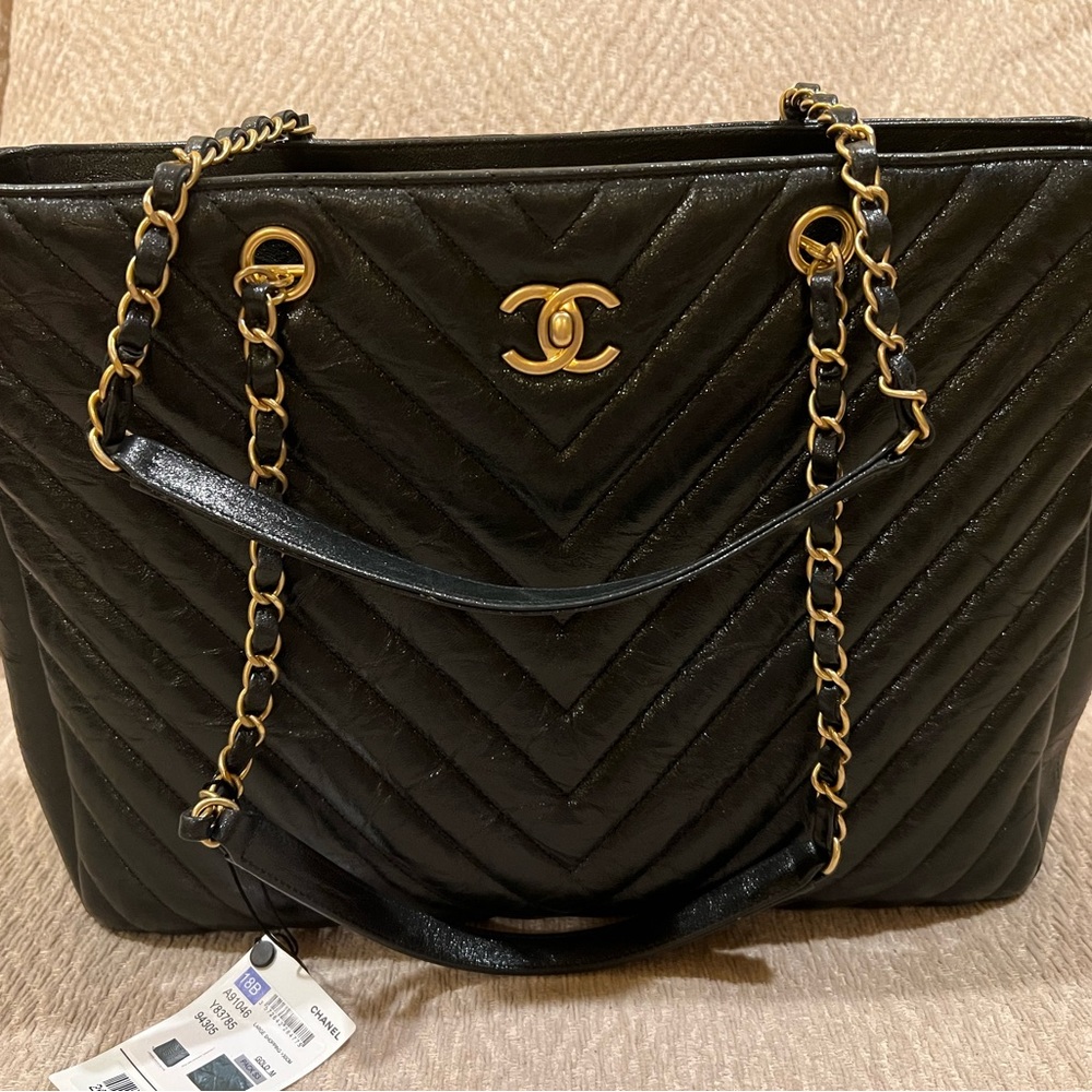 CHANEL Black Tote with Chain Strap and Quilted Design